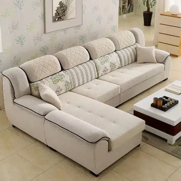 A large, beige fabric sectional sofa