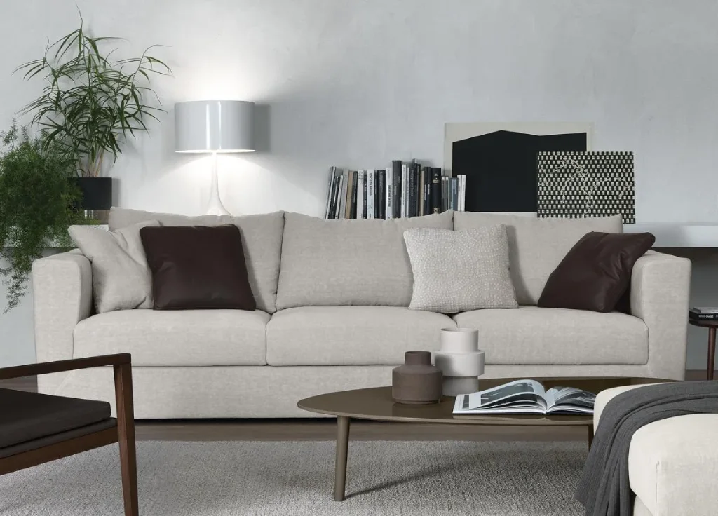 A modern, beige fabric sofa with plush cushions and a clean, minimalist design