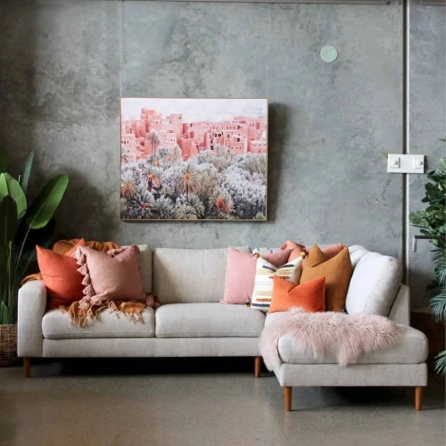 A modern living room with a grey sectional sofa featuring a chaise lounge.